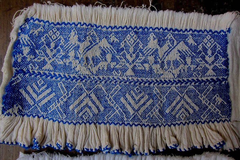 Ixtenco_embroidery_ (10 of 34).jpg - Embroidery sample used to duplicate, some of these have been passed down from the grandmothers. This is part of the front of the blouse, the "pepinada" stitch is smocking, these traditional designs have been past on from generation to generation here in the Otomi town of Ixtenco, Tlaxcala.